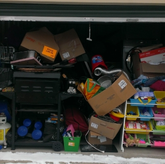 Public storage with boxes, sports equipment and toys.