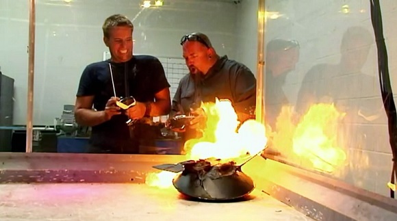 Allen Haff and Ton Jones watch as their battle bot goes up in flames on Auction Hunters.