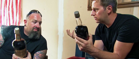 Bottles of whiskey held by Ton Jones and Allen Haff.