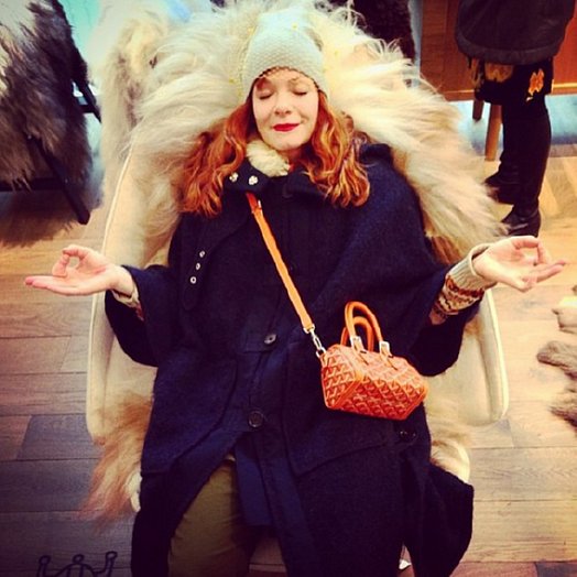 Candy Olsend sits on fur chair.