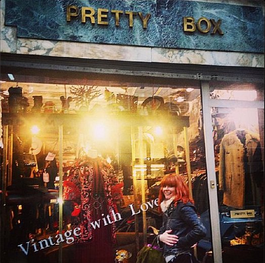 Candy Olsen stands in front of Pretty Box vintage store.