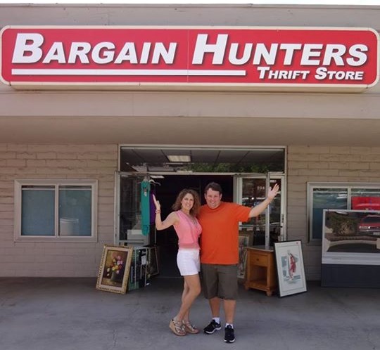 Casey and Rene Nezhoda stand in front of their thrift store.